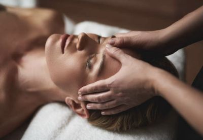 Woman receiving a facial service at Shek Salon.jpeg
